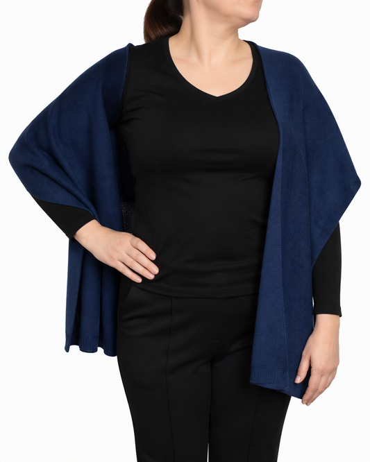 English Rib Scarf in Deepwater, a deep navy Merino wool rib knit, draped open around the neck